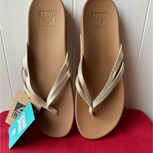 Gold tone sandals by Reef.